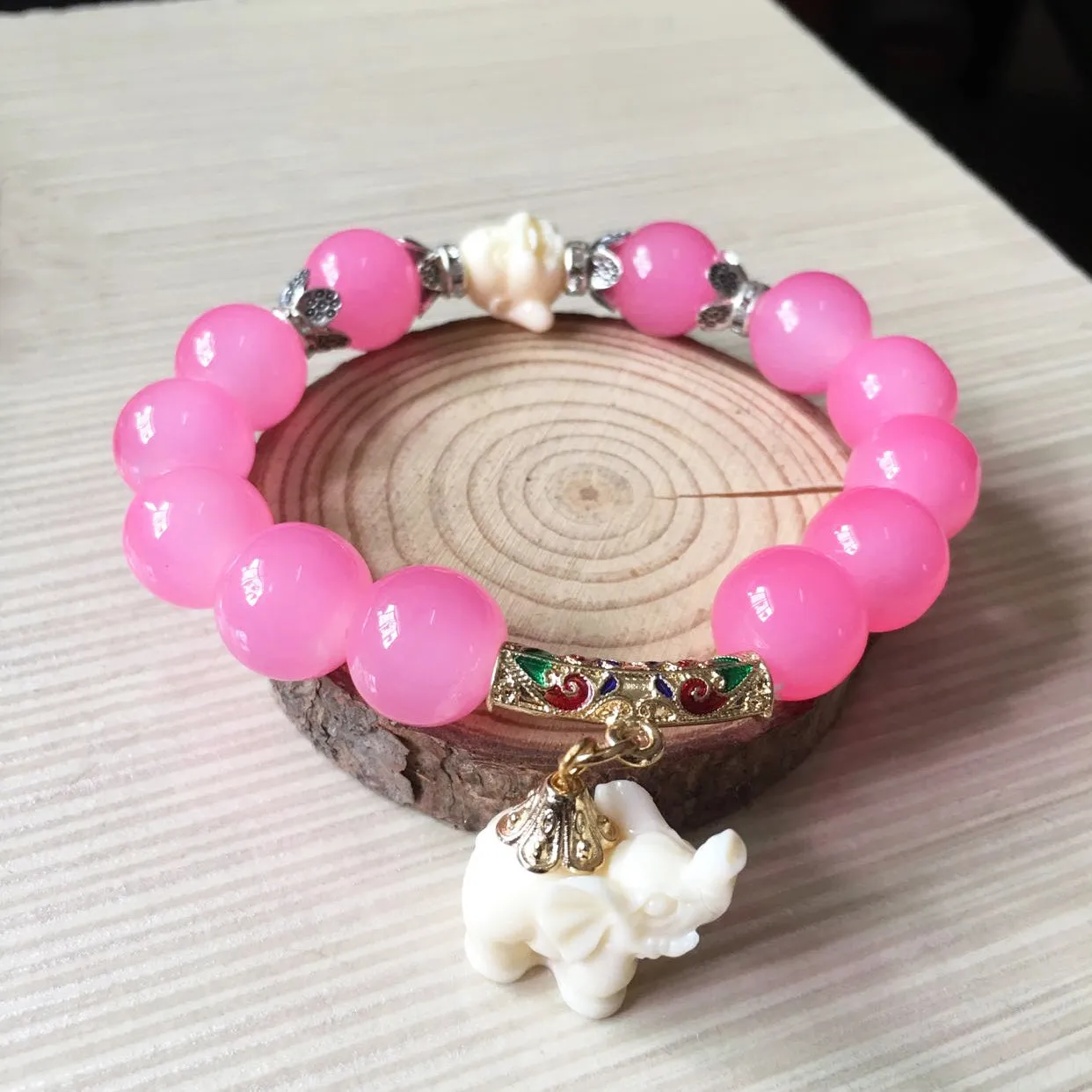 Crystal elephant charm bracelet with clear beads and gold finish metal charm