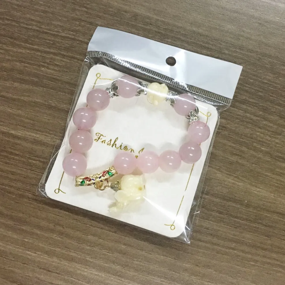 Crystal elephant charm bracelet with clear beads and gold finish metal charm