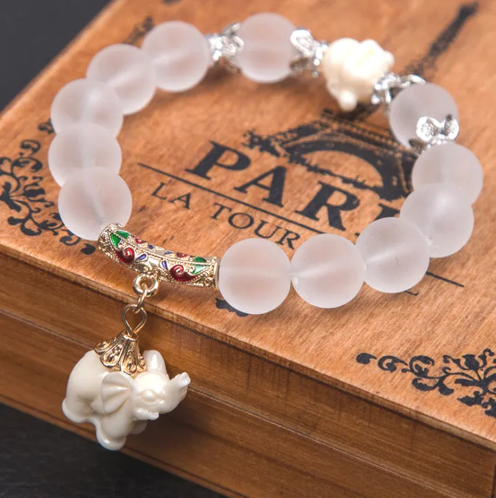 Crystal elephant charm bracelet with clear beads and gold finish metal charm