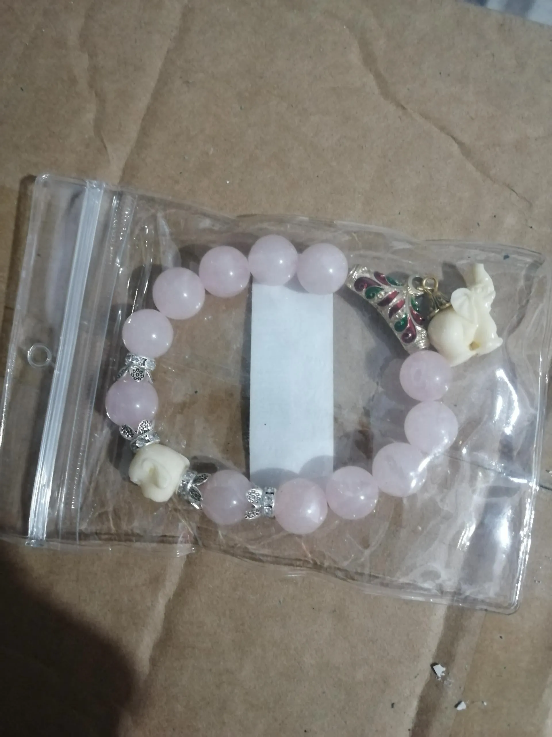 Crystal elephant charm bracelet with clear beads and gold finish metal charm