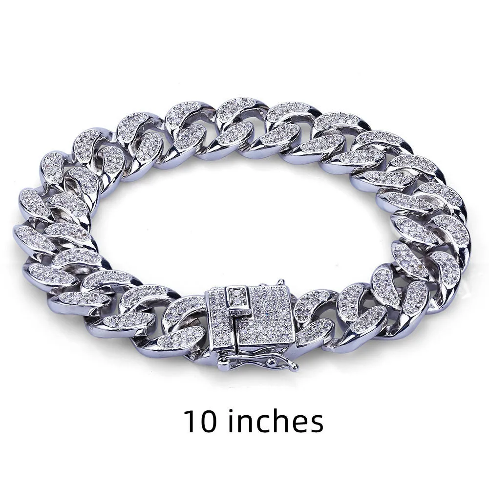 Men's Cuban chain bracelet with gold finish and geometric zircon pendant on a flat surface