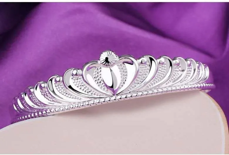 Silver electroplated crown bracelet for women on white background