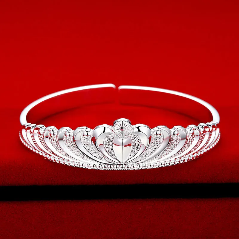 Silver electroplated crown bracelet for women on white background