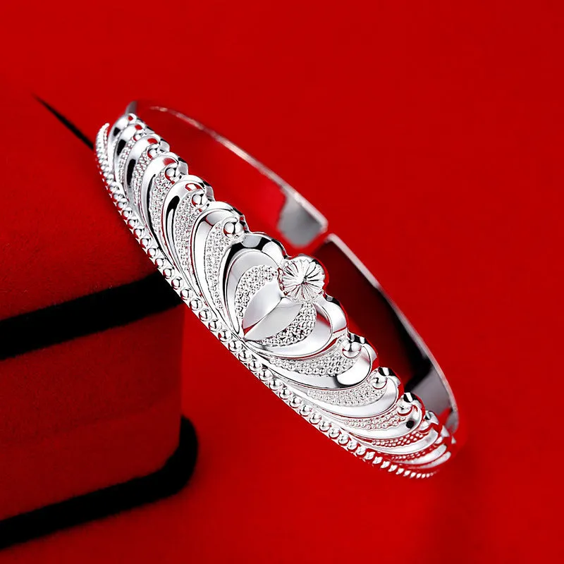 Silver electroplated crown bracelet for women on white background