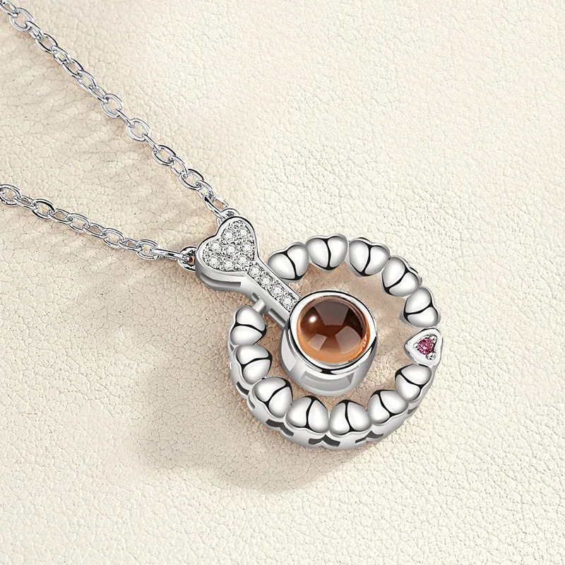 Gold love projection necklace with 100 languages pendant on 50cm copper chain