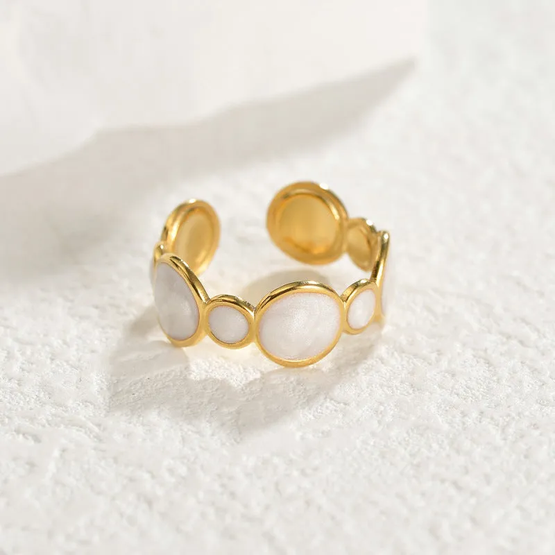 Stainless steel geometric ring with an adjustable opening band for women.