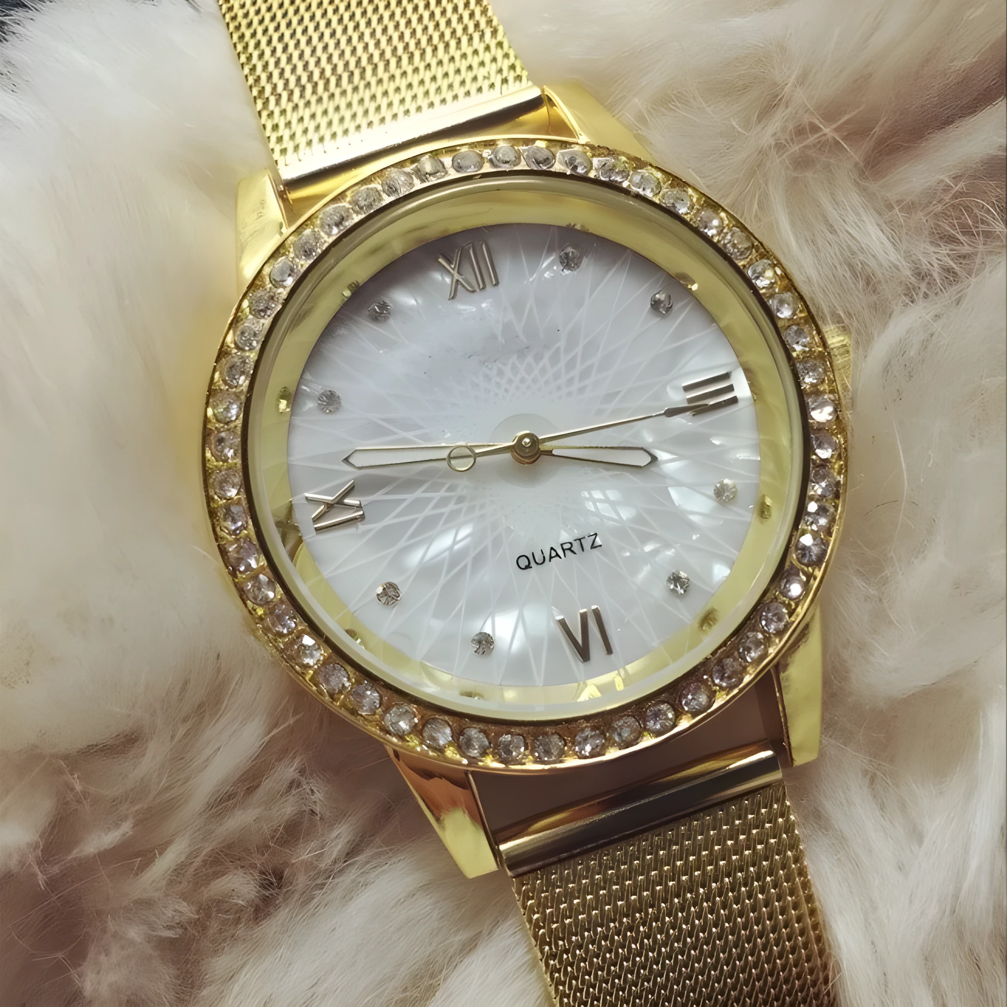 Golden mesh strap alloy electronic watch with round dial and world time GMT functions on a plain background