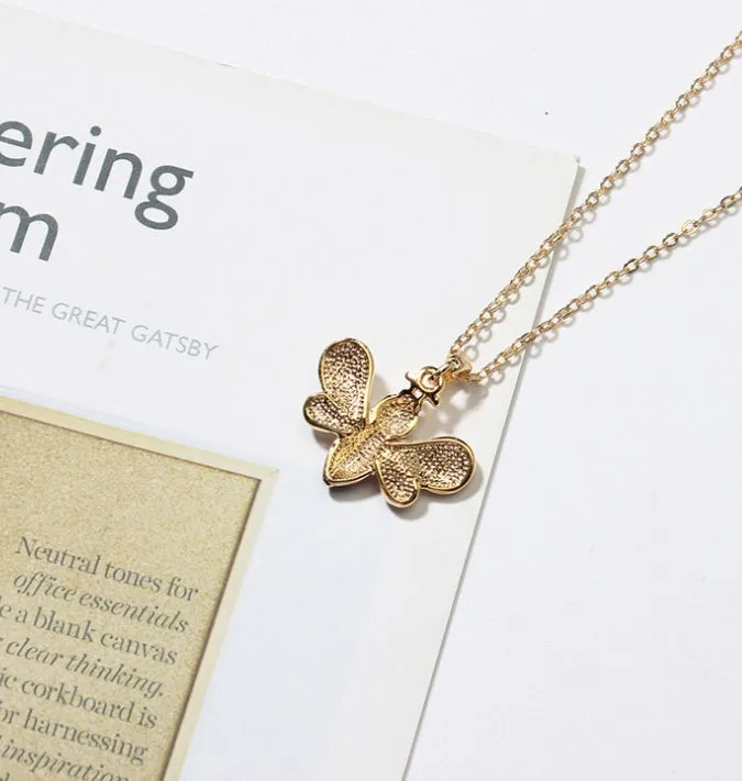 Cartoon bee drop pendant necklace with oil studded alloy finish on cross chain, yellow colour option, on white background