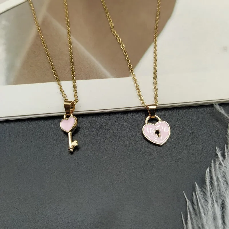 Small alloy lock and key pendant necklace set in black with 40cm chain on white background