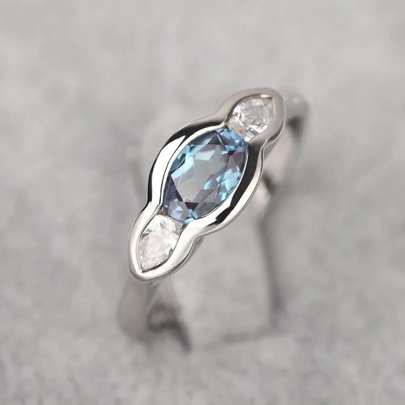Geometric ellipse zircon ring in white gold colour on copper base