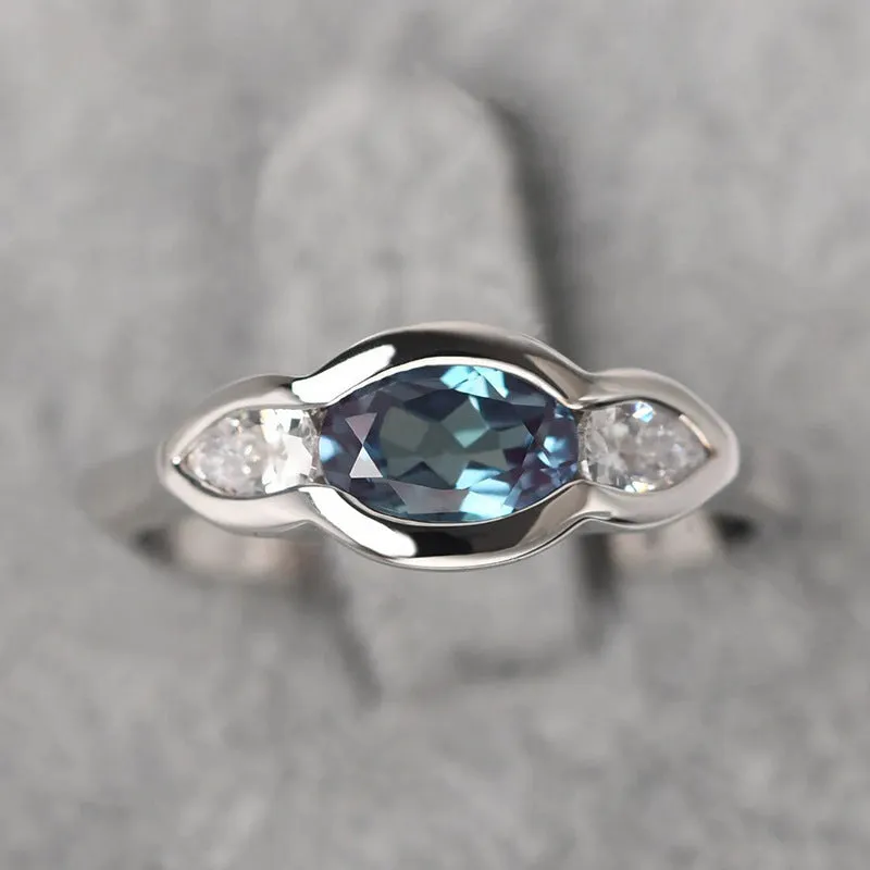 Geometric ellipse zircon ring in white gold colour on copper base