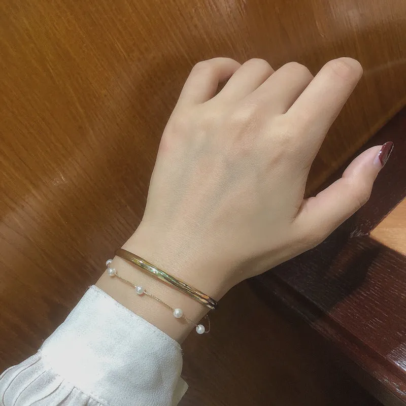 Double layered pearl coloured electroplating alloy bracelet, Korean style geometric design for women