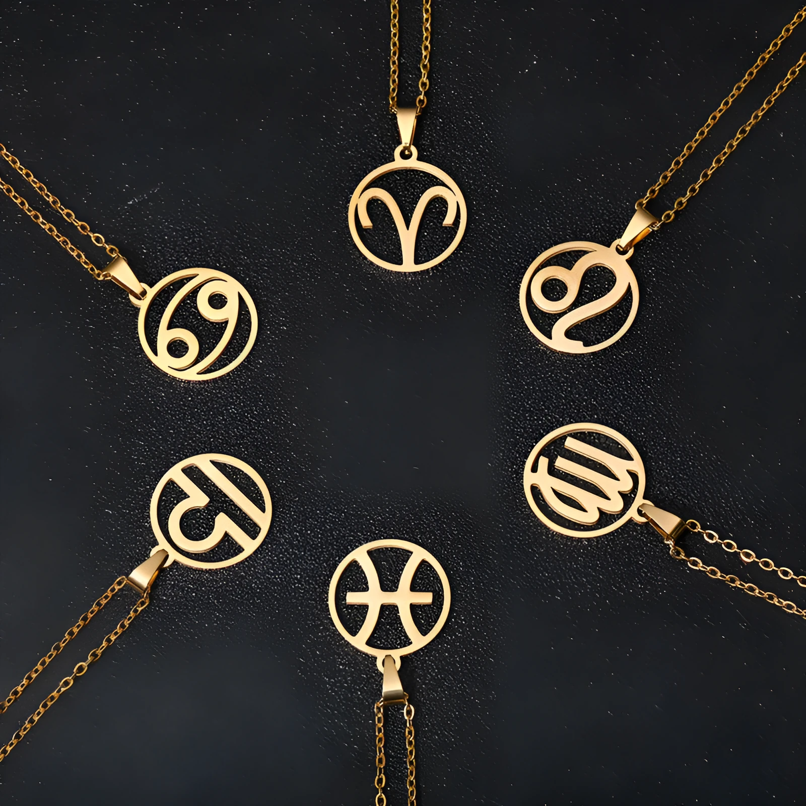 Set of 12 stainless steel horoscope pendant necklaces with vacuum plating gold finishes on a white background