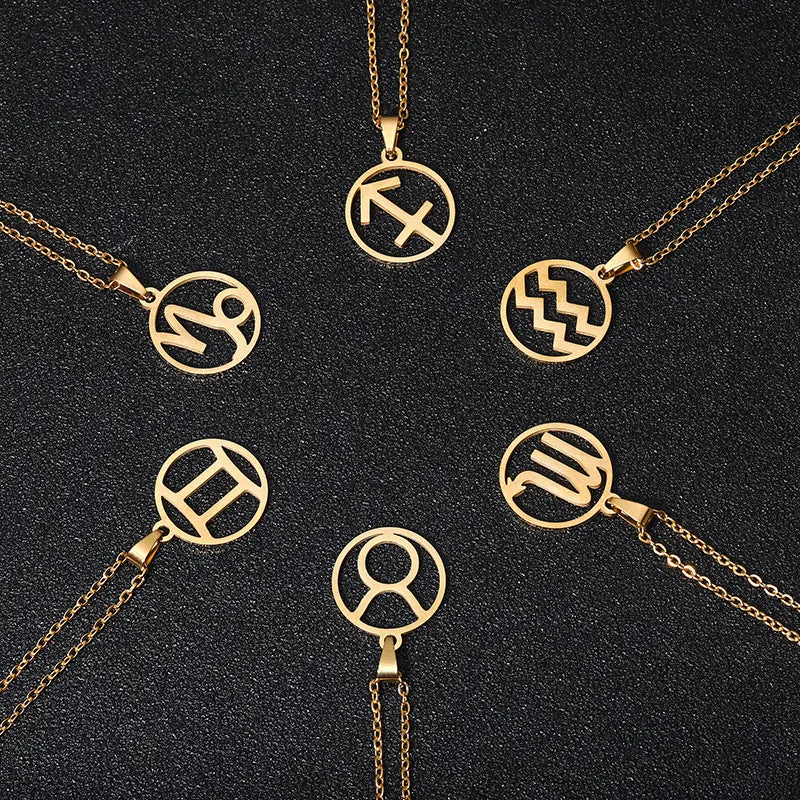 Set of 12 stainless steel horoscope pendant necklaces with vacuum plating gold finishes on a white background