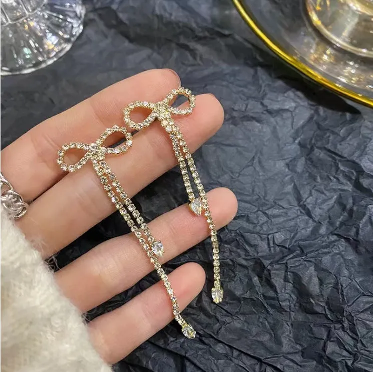 Fashion jewellery silver needle long bow tie full-jeweled stud earrings for women in gold and silver drop shape
