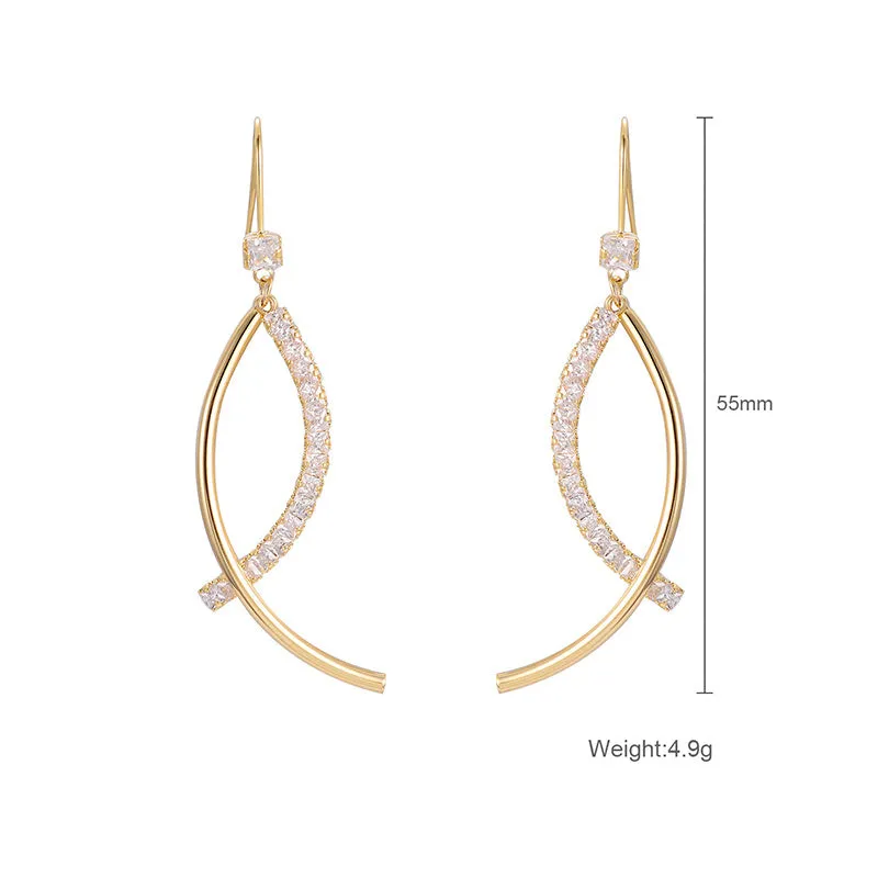 Pair of gold irregular geometric copper earrings on display