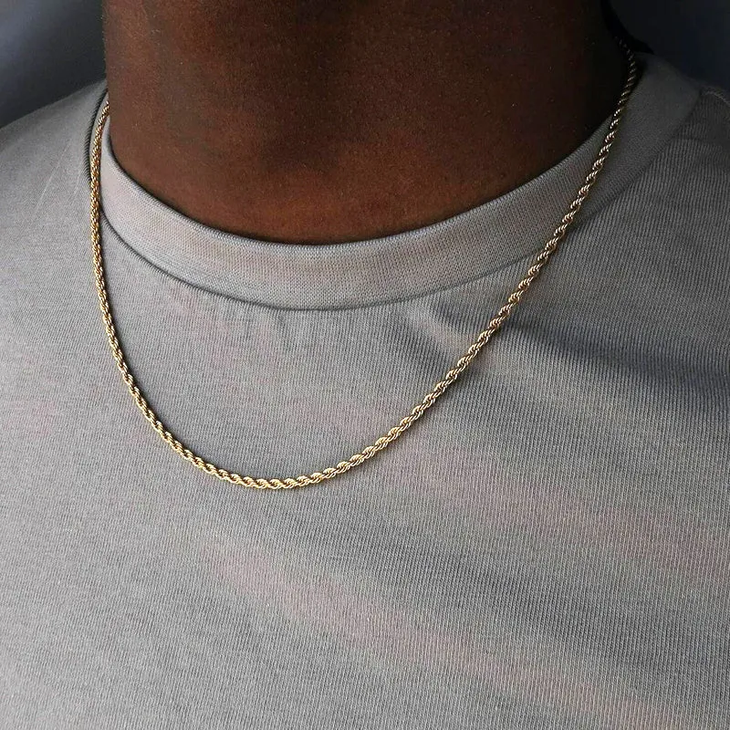 Less steel Figaro Cuban chain necklace in silver on white background showing links and clasp