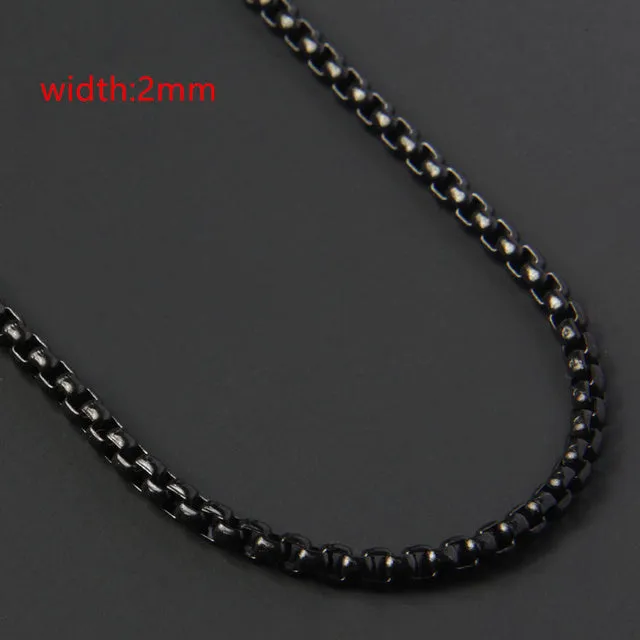 Less steel Figaro Cuban chain necklace in silver on white background showing links and clasp