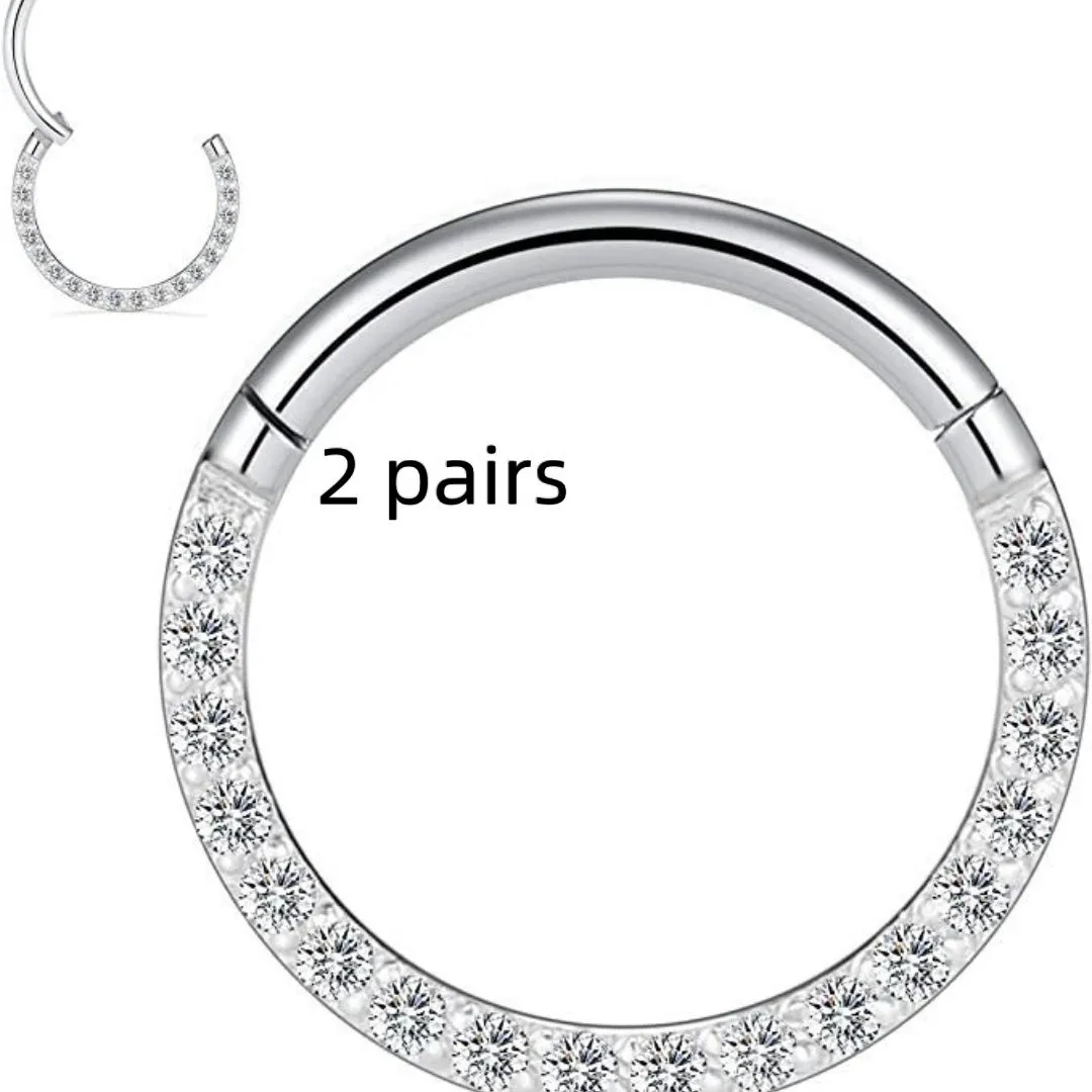 Close-up of a round, seamless stainless steel nose ring in a gold finish, showing its smooth, clasp-free design.