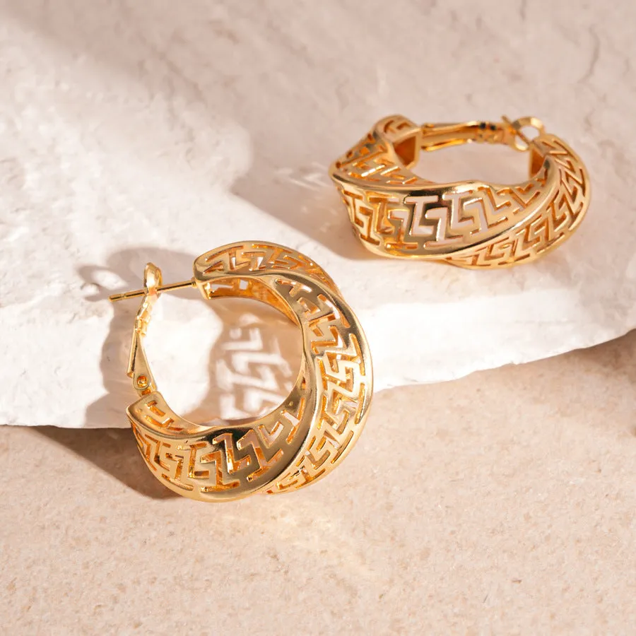 Geometric hollow stud earrings in gold and silver colours with twisted round design