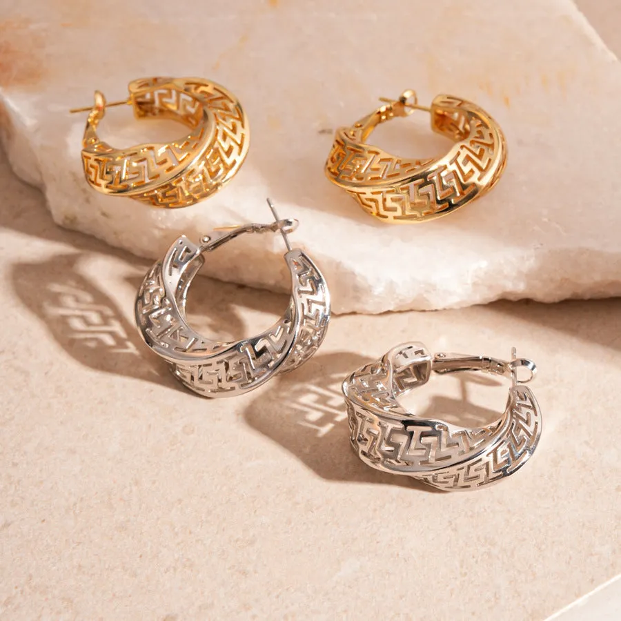 Geometric hollow stud earrings in gold and silver colours with twisted round design
