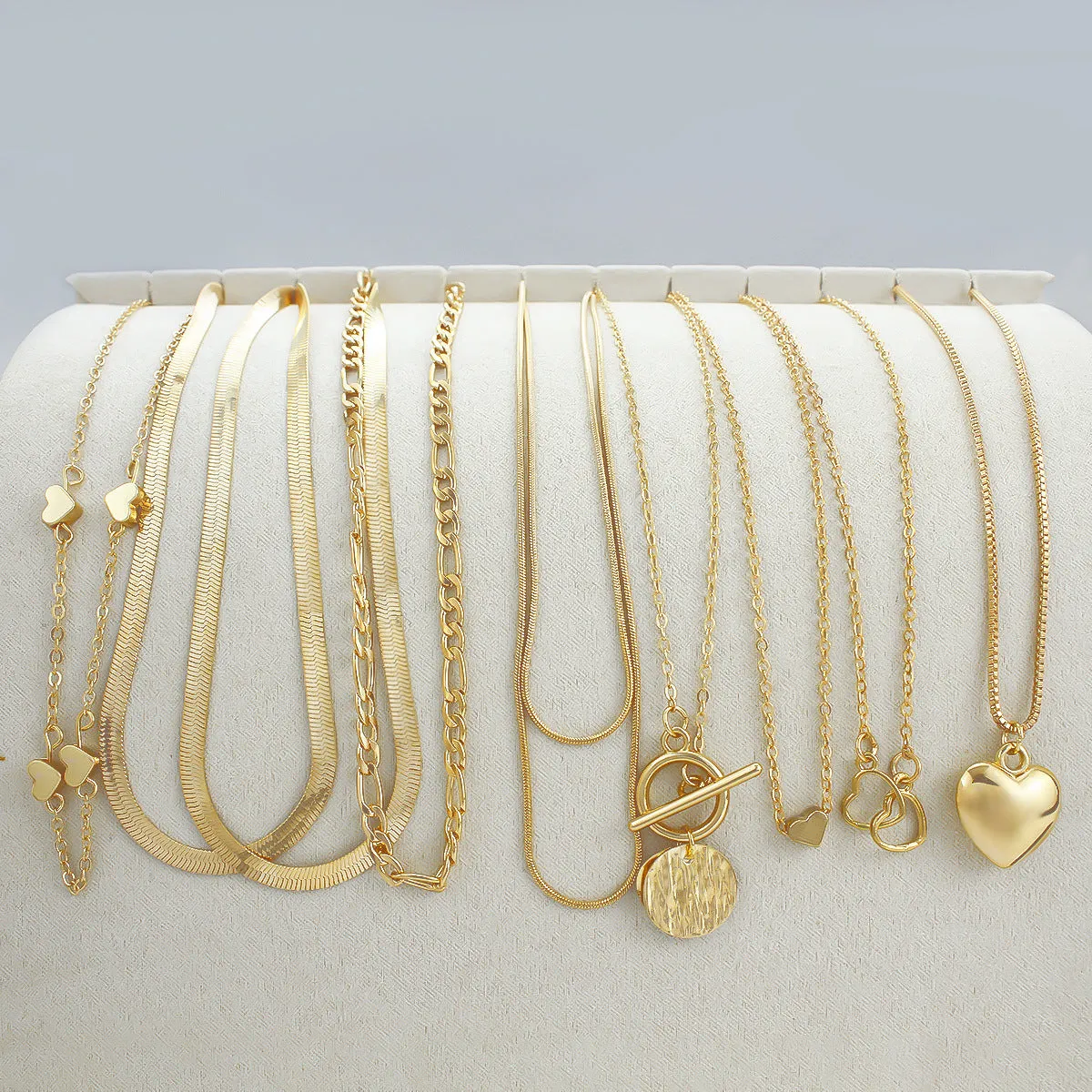 Gold electroplated women's necklace set with 10 pieces and adjustable snake bones chain