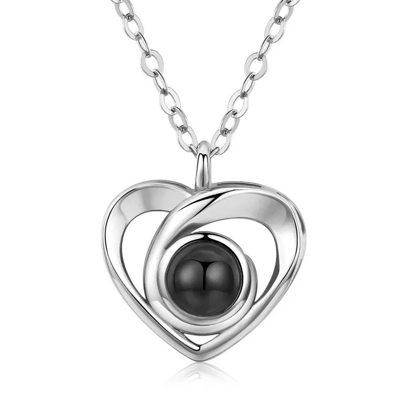 S925 silver heart shaped photo projection pendant necklace with silver finish on white background