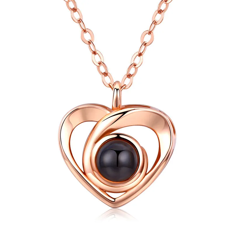 S925 silver heart shaped photo projection pendant necklace with silver finish on white background