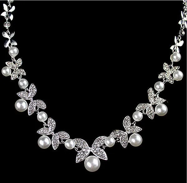 Bridal jewellery set with leaf design necklace and earrings featuring simulated pearls and cubic zirconia in silver white
