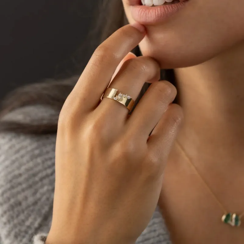 Gold electroplated copper ring with shining zircon stone showing front view