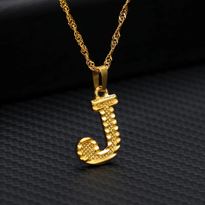 Gold-plated alloy initial pendant necklace with 42cm chain on white background