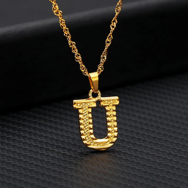Gold-plated alloy initial pendant necklace with 42cm chain on white background