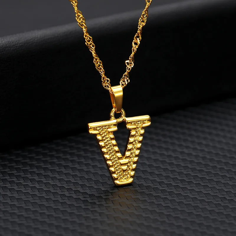 Gold-plated alloy initial pendant necklace with 42cm chain on white background