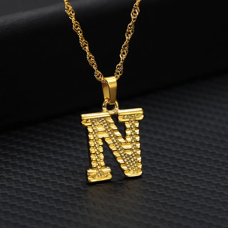 Gold-plated alloy initial pendant necklace with 42cm chain on white background