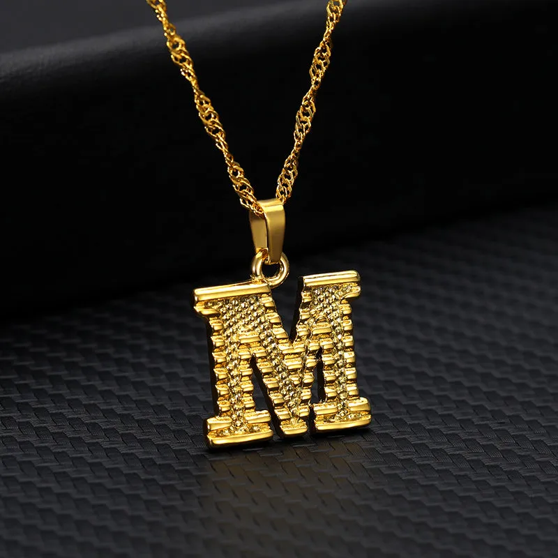 Gold-plated alloy initial pendant necklace with 42cm chain on white background