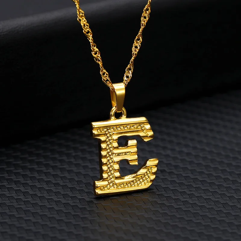 Gold-plated alloy initial pendant necklace with 42cm chain on white background