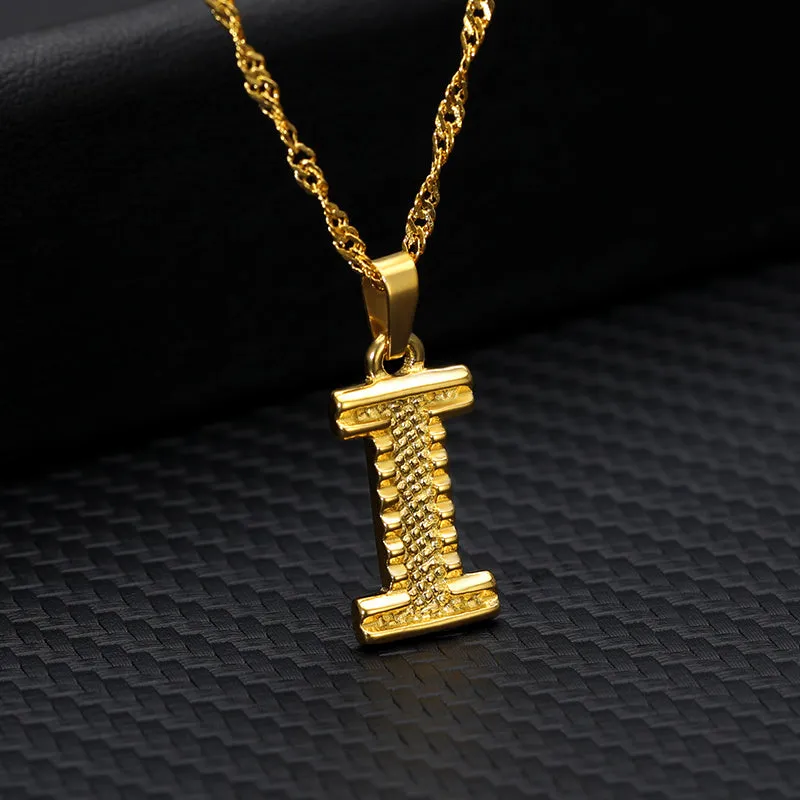 Gold-plated alloy initial pendant necklace with 42cm chain on white background