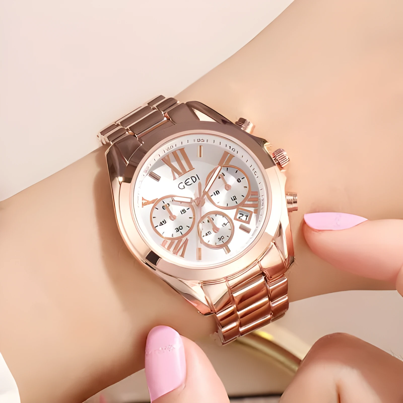 Luxury rose gold women casual watch with steel strap, 35mm dial, on a wrist