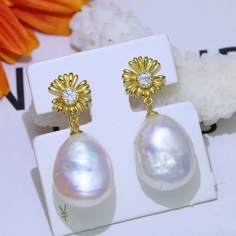 S925 sterling silver baroque flower earrings on a silver ring holder, showing gold and silver colour frame options.
