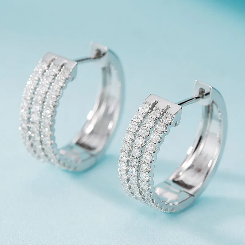 18K white gold natural diamond earrings with 56 point diamond in platinum finish on light background