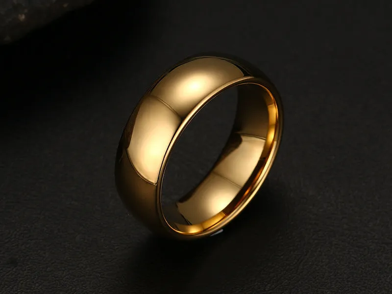 Gold tungsten carbide signet ring on display showing unisex design and metallic finish