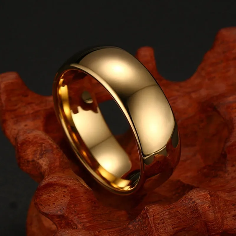 Gold tungsten carbide signet ring on display showing unisex design and metallic finish