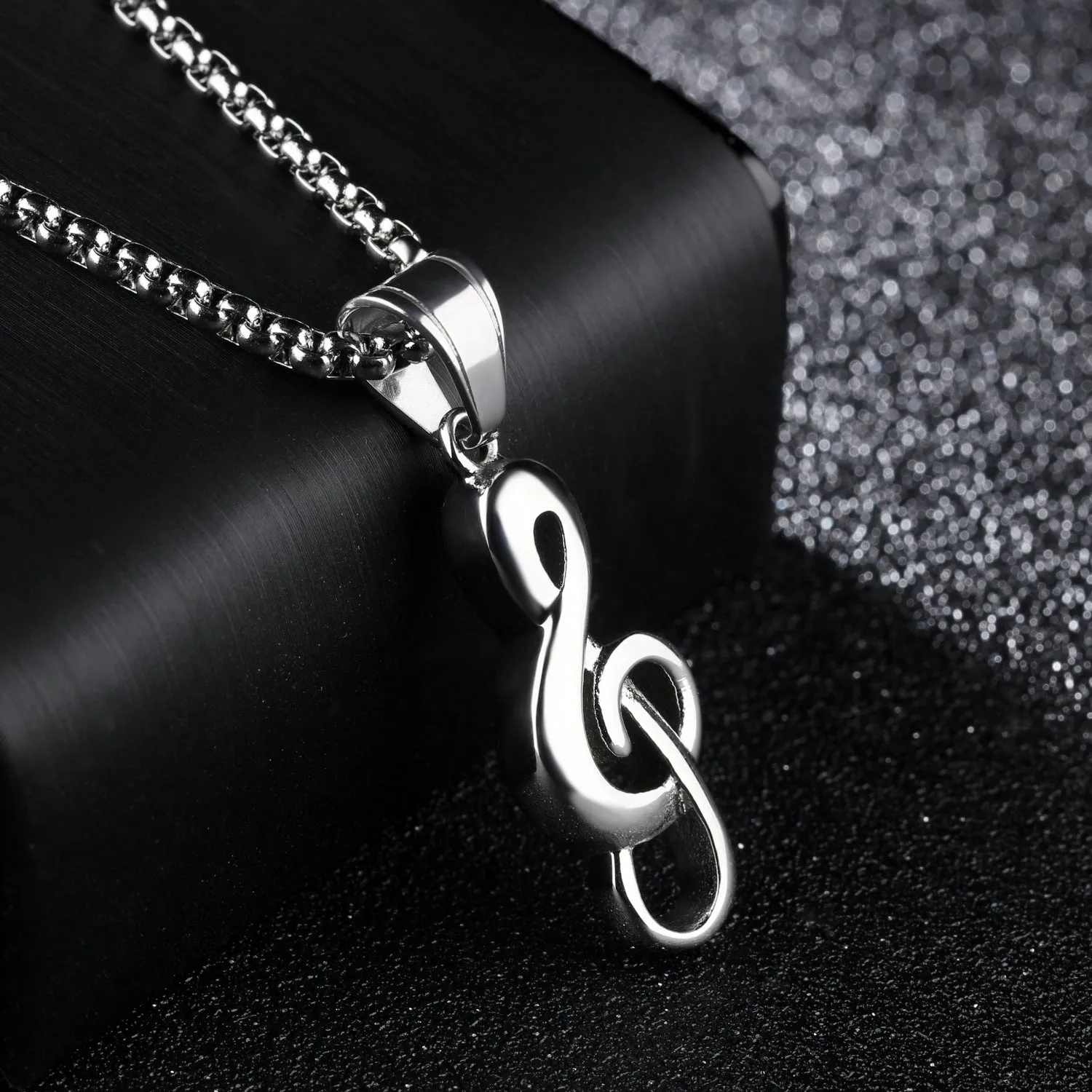Gold music symbol pendant made from titanium steel on a chain