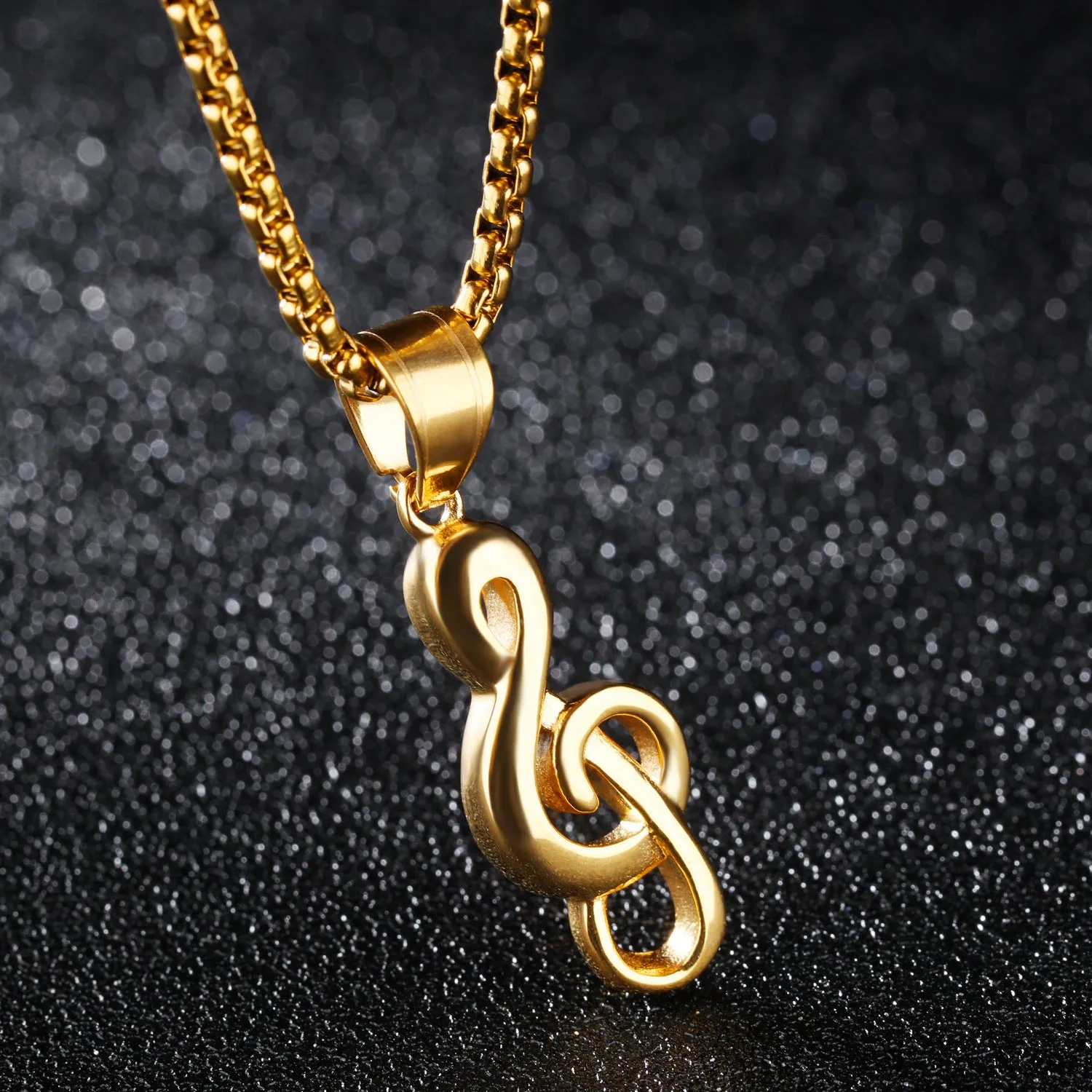 Gold music symbol pendant made from titanium steel on a chain