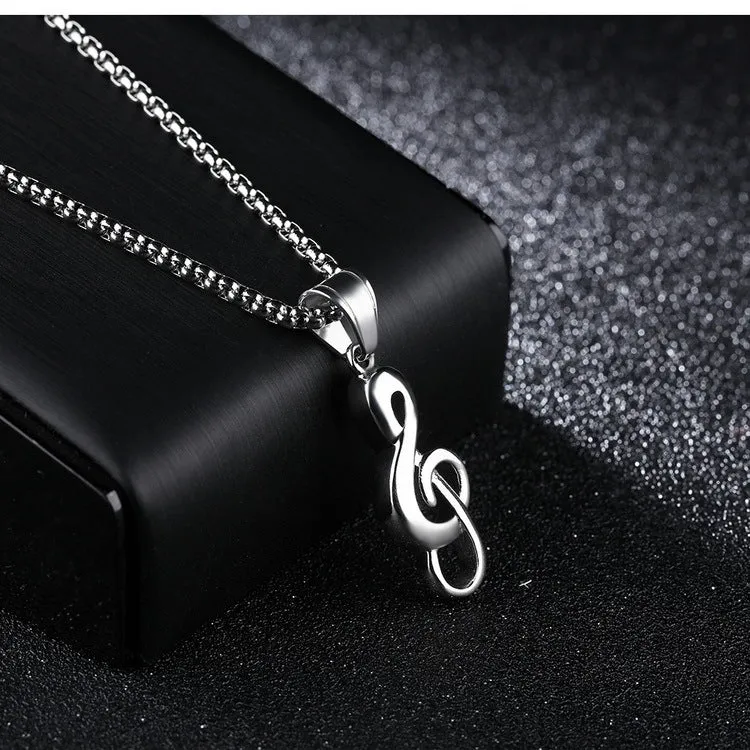 Gold music symbol pendant made from titanium steel on a chain