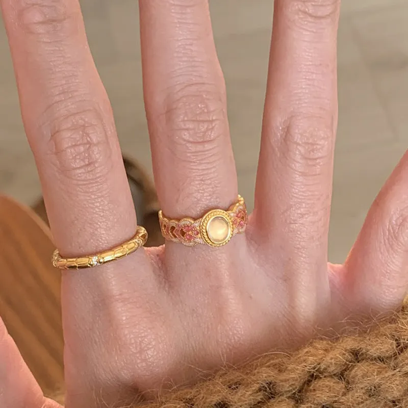 Geometric open ring for women in gold-plated copper with a pink crystal enamel detail.