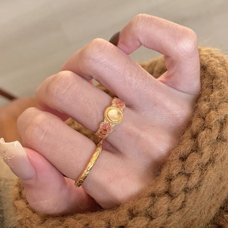 Geometric open ring for women in gold-plated copper with a pink crystal enamel detail.