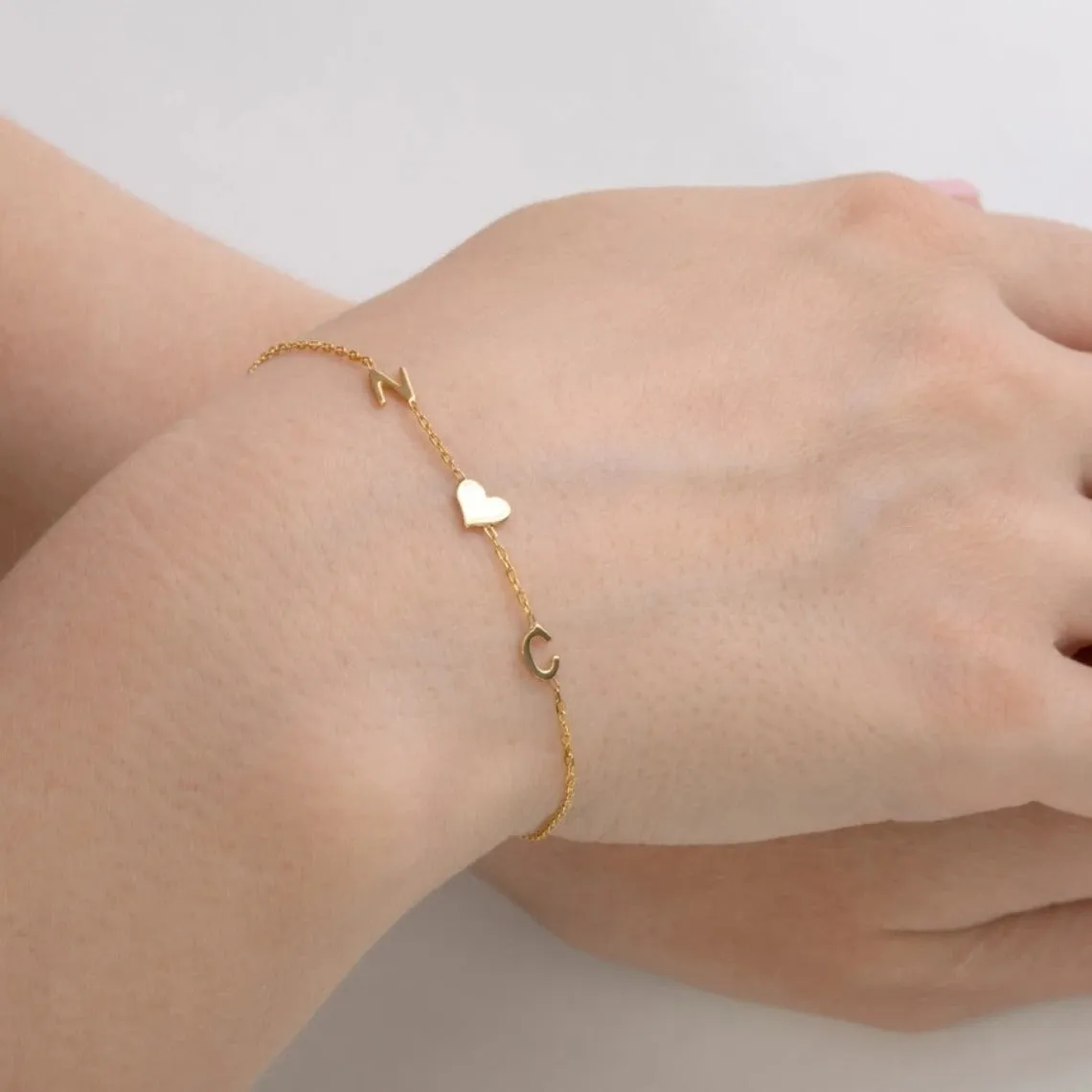 Gold stainless steel custom name bracelet with heart charm and personalised initials