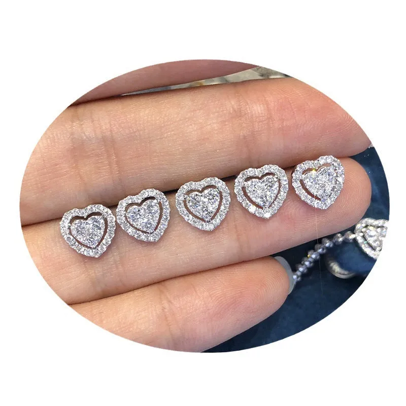 White zircon heart stud earrings with electroplated finish, post-back closure, compact design