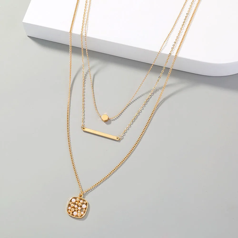Multi-layer gold necklace with geometric pineapple pendant on adjustable chain, electroplated finish, zinc alloy